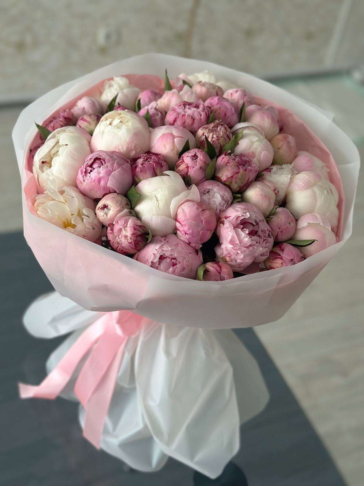 Experience the beauty of premium peonies with our Bountiful Peony Bouquet. Handcrafted by Phoenix florists and available for same-day delivery. Shop luxury flowers today.
