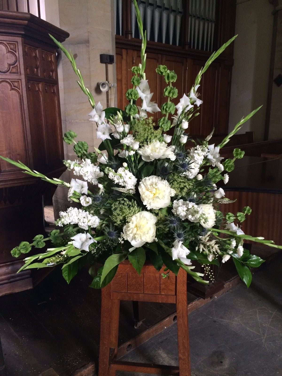 Heartfelt Sympathies White Green Funeral Standing Arrangement, available for same day delivery in Gilbert, Queen Creek, Chandler, Mesa, Tempe, Phoenix Arizona