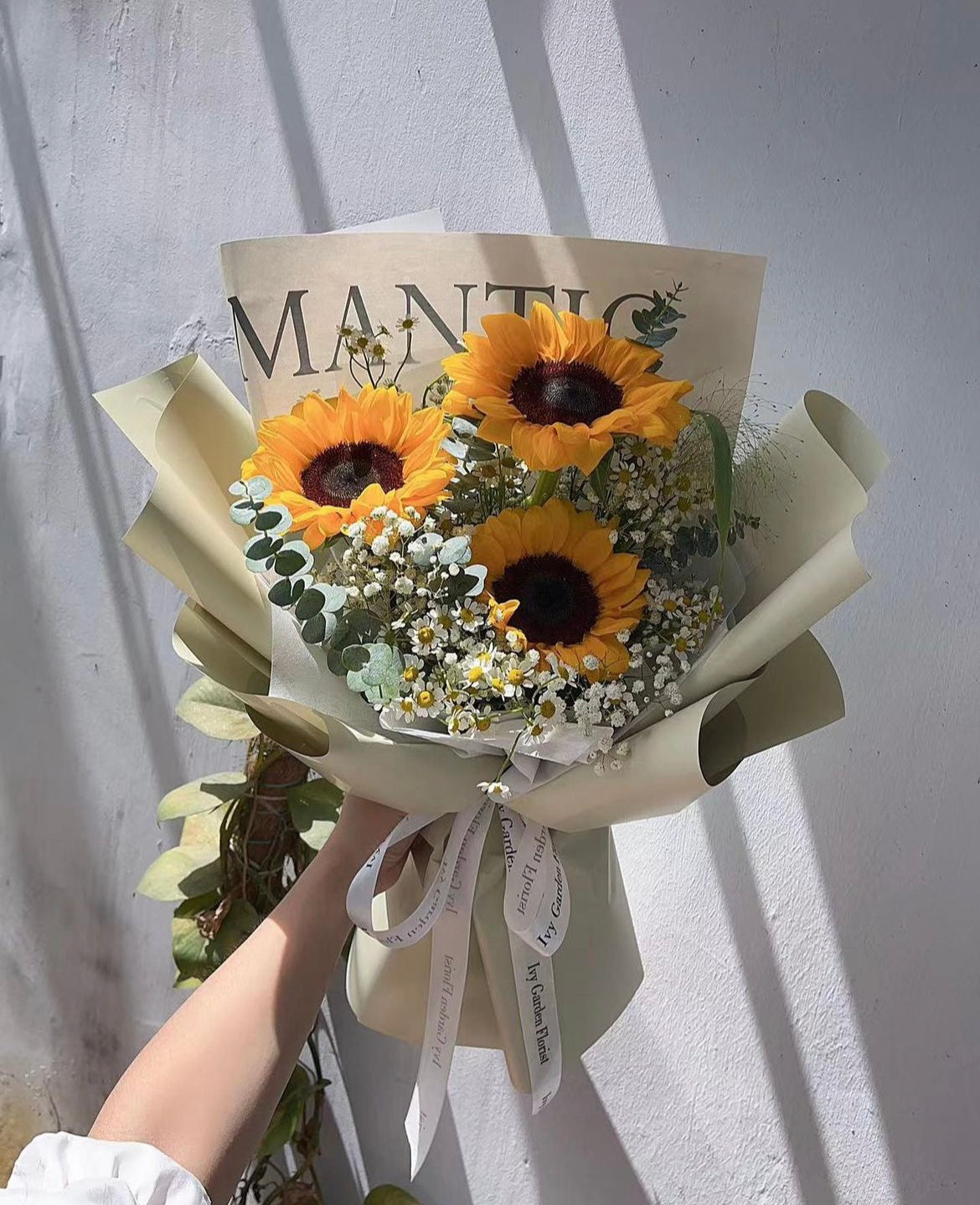 Mini sunflower bouquet wrapped in Korean-style paper