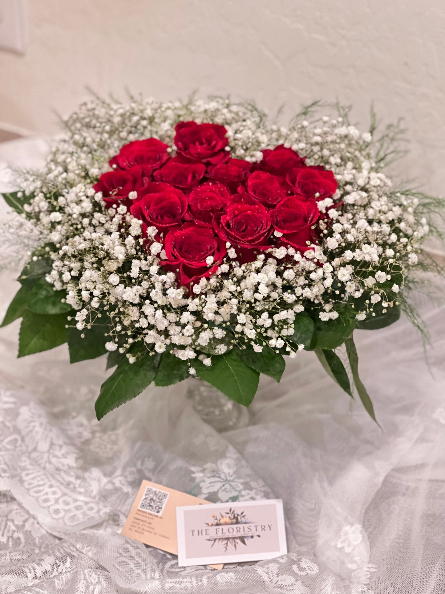Romantic floral heart of roses designed by a florist for Valentine’s Day, anniversaries, or special celebrations.