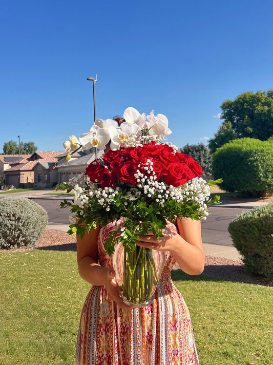 Premium long stem red roses with white orchid. Elegant bouquet 