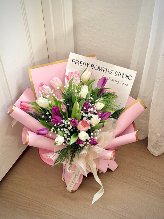Beautiful Tulips Kisses bouquet with soft tulips and white baby breath, thoughtfully arranged for delivery. A fresh and elegant gift for any occasion.