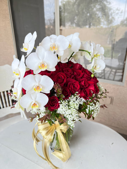 Luxury White Orchids symbolize purity, sophistication, paired with Premium Red Roses exude love and romance. Designed to impress, perfect for anniversaries, or moments when only the finest will do. 