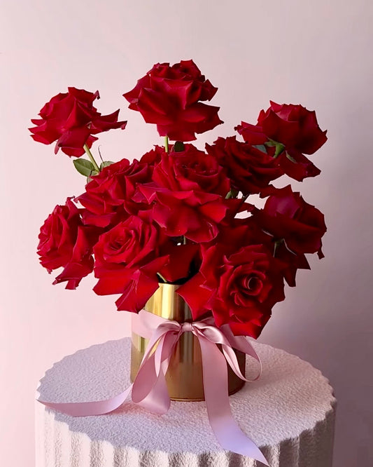 Classy red roses only centerpiece styled in a modern, artistic cloud arrangement