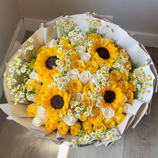 Our Yellow Mix Bouquet combines radiant blooms like roses, sunflowers, and seasonal accents 