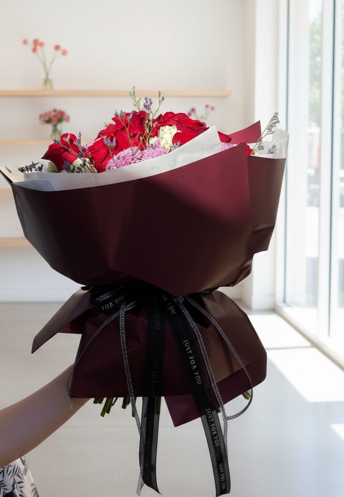 This luxurious arrangement features a stunning blend of red and ivory, fluffy hydrangeas