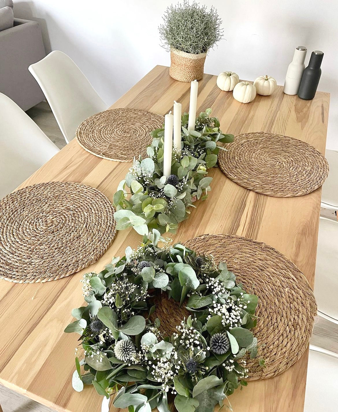 Fresh silver dollar eucalyptus centerpiece with soft cascading greenery for table décor.
